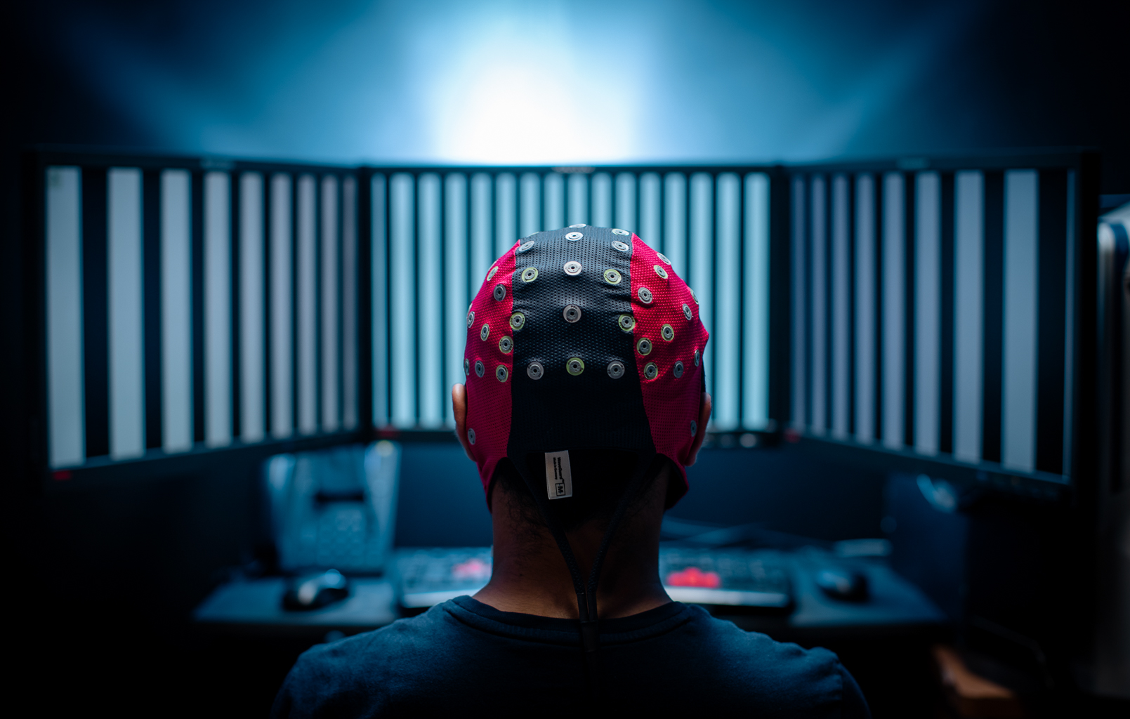 Back of head of somene wearing cap with electrodes